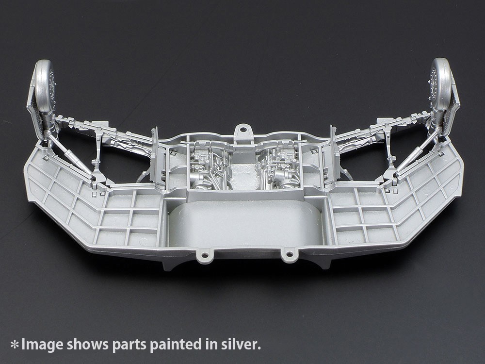 The spar prevents wings from deforming and allows easy assembly. Engine sections visible from the air exhaust outlet doors are depicted